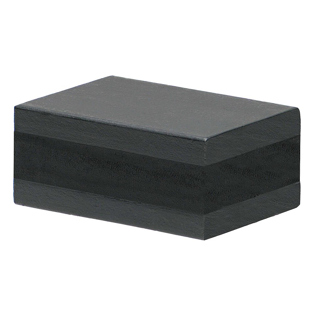 an elongated, black elastomer, vulcanized in between two black-lacquered metal plates, isolated on white background
