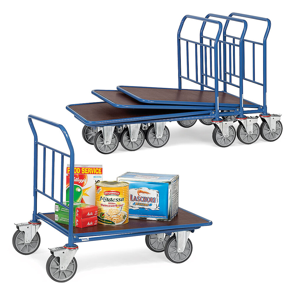 a composition of four blue FETRA® platform trolleys, each with push bar made from steel tube, two fixed wheels at the front, two fastenable steering wheels at the rear and brown wooden loading platform, three carts stacked into each other and the front single one loaded with various food articles, isolated on white background
